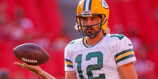 Aaron Rodgers, #12 of the Green Bay Packers, participates in pregame warmups prior to the preseason game against the Kansas City Chiefs at Arrowhead Stadium on Aug. 25, 2022 in Kansas City, Missouri.