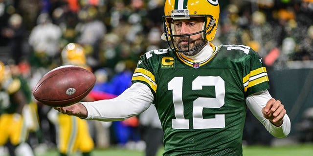 Dec 19, 2022; Green Bay, Wisconsin, USA; Green Bay Packers quarterback Aaron Rodgers (12) warms up before game against the Los Angeles Rams at Lambeau Field.