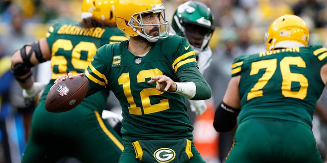 Aaron Rodgers, #12 of the Green Bay Packers, drops back to pass against the New York Jets at Lambeau Field on Oct. 16, 2022 in Green Bay, Wisconsin.