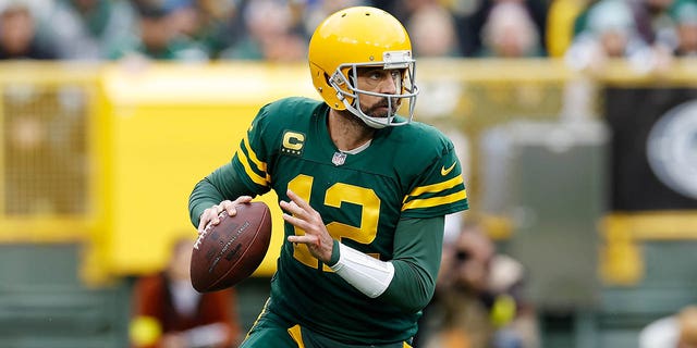 Aaron Rodgers, #12 of the Green Bay Packers, drops back to pass against the New York Jets at Lambeau Field on Oct. 16, 2022 in Green Bay, Wisconsin.