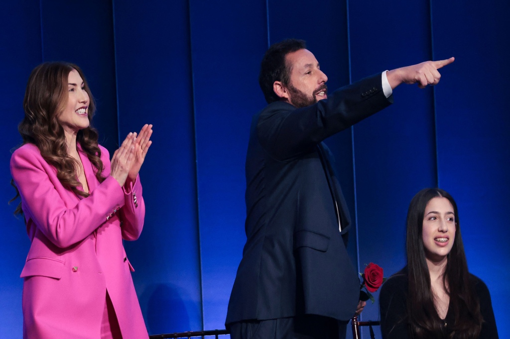 Sandler next to his wife Jackie and their daughter Sadie, during the 24th Annual Mark Twain Prize For American Humor at the John F. Kennedy Center for the Performing Arts in Washington, DC, on March 19, 2023.