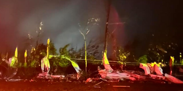 Debris wrapped around trees in Amory, Miss., after a tornado struck the town on Friday, March 24, 2023.