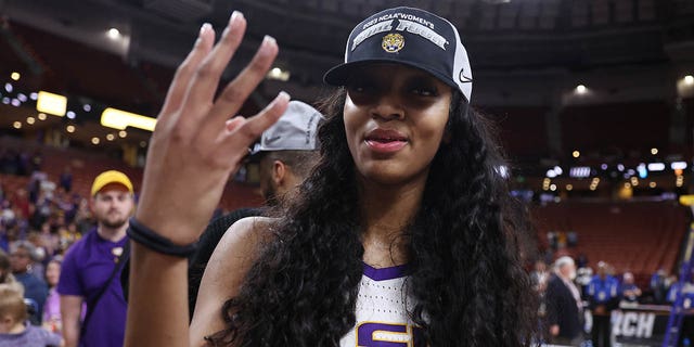 Angel Reese, #10 of the LSU Lady Tigers, celebrates after defeating the Miami Hurricanes 54-42 in the Elite Eight round of the NCAA Women's Basketball Tournament at Bon Secours Wellness Arena on March 26, 2023 in Greenville, South Carolina.