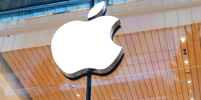 Apple logo seen above the entrance of the Apple store in Marunouchi, Tokyo. 