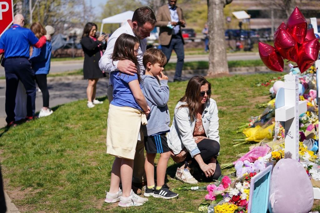 Mourners at a makeshift memorial for the victims of the shooting at The Covenant School in Nashville.