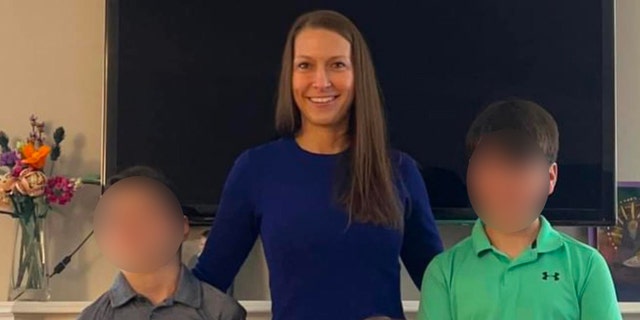 Becky Bliefnick poses with her three sons.