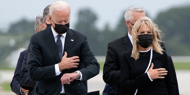 President Joe Biden and first lady Jill Biden attend the dignified transfer of the remains of service members killed in Afghanistan at Dover Air Force Base in Delaware, Aug., 29, 2021.