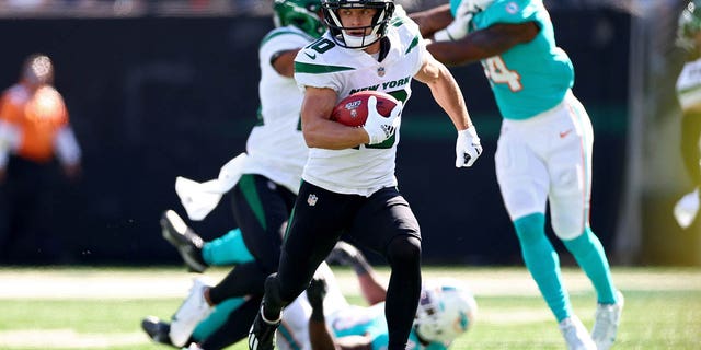 Braxton Berrios, #10 of the New York Jets, runs against the Miami Dolphins during the first quarter at MetLife Stadium on Oct. 9, 2022 in East Rutherford, New Jersey.