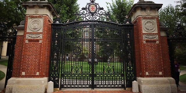 The Van Wickle Gates stand at the edge of the main campus of Brown University in Providence, R.I., Aug. 16, 2022.