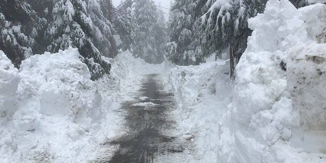 Snow drifts are seen in Lake Arrowhead, Calif., after a winter storm hit the area this week.