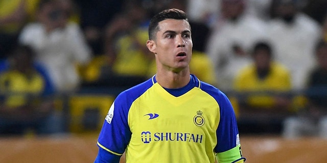 Nassr's Portuguese forward Cristiano Ronaldo stands over a free-kick during the Saudi Pro League football match between Al-Nassr and Al-Batin at the Mrsool Park Stadium in the Saudi capital Riyadh on March 3, 2023.