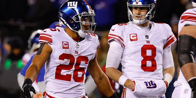 New York Giants running back Saquon Barkley (26) and quarterback Daniel Jones (8) during an NFC divisional playoff game against the Philadelphia Eagles Jan. 21, 2023, at Lincoln Financial Field in Philadelphia.