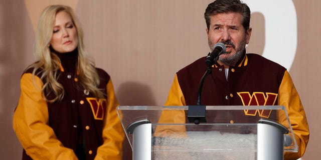 Washington Commanders co-owner Dan Snyder, right, speaks as co-owner Tanya Snyder, left, listens during a press conference revealing the Commanders as the new name for the formerly named Washington Football Team at FedEx Field Feb. 2, 2022 in Landover, Maryland.