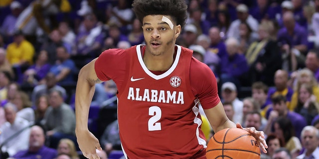 Darius Miles, #2 of the Alabama Crimson Tide, drives with the ball against the LSU Tigers during a game at the Pete Maravich Assembly Center on March 5, 2022 in Baton Rouge, Louisiana.