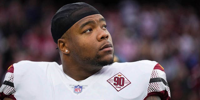 Daron Payne, #94 of the Washington Commanders, stands during the national anthem against the Houston Texans at NRG Stadium on Nov. 20, 2022 in Houston.