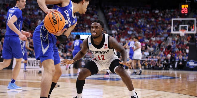 Mar 26, 2023; Louisville, KY, USA;  Creighton Bluejays guard Ryan Nembhard (2) and San Diego State Aztecs guard Darrion Trammell (12) battle for the ball during the second half at the NCAA Tournament South Regional-Creighton vs San Diego State at KFC YUM! Center.