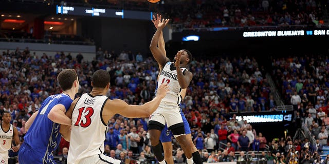 Ryan Nembhard #2 of the Creighton Bluejays fouls Darrion Trammell #12 of the San Diego State Aztecs during the second half in the Elite Eight round of the NCAA Men's Basketball Tournament at KFC YUM! Center on March 26, 2023 in Louisville, Kentucky.