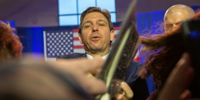 Florida Gov. Ron DeSantis signs books in Des Moines on March 10, 2023. 