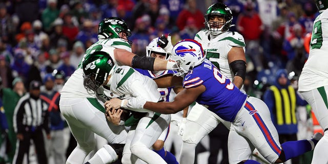 Ed Oliver #91 of the Buffalo Bills sacks Zach Wilson #2 of the New York Jets during the third quarter at Highmark Stadium on January 09, 2022 in Orchard Park, New York.