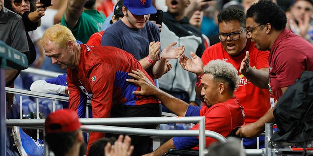 Puerto Rico pitcher Edwin Diaz, #39, leaves the field on a wheelchair after an apparent leg injury during the team celebration against Dominican Republic at LoanDepot Park in Miami March 15, 2023.