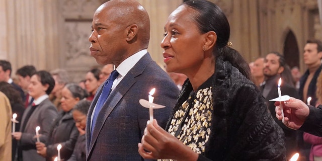 New York City Mayor Eric Adams, Former Mayor of New York City Rudy Giuliani, Rabbi Joseph Potasnik and dozens people attend midnight Christmas midnight mass at St. Patrick's Cathedral in Manhattan, New York, on Dec. 25, 2022. 