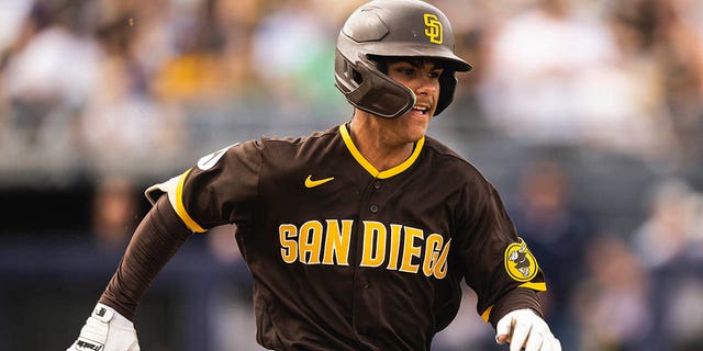 Ethan Salas, #85 of the San Diego Padres, sprints to first base during a spring training game against the Chicago White Sox on March 11, 2023 in Peoria, Arizona. This marks the first game the for 16 year-old 2023 international draft pick.