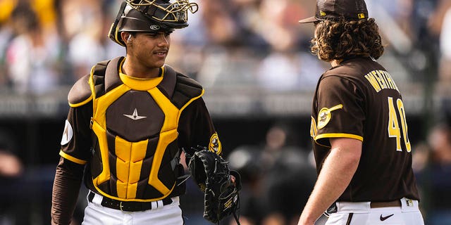 Ethan Salas, #85 of the San Diego Padres, catches during a spring training game against the Chicago White Sox on March 11, 2023 in Peoria, Arizona.