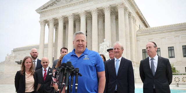 Former Bremerton High School assistant football coach Joe Kennedy answers questions after his legal case, Kennedy vs. Bremerton School District, was argued before the Supreme Court on April 25, 2022 in Washington, DC.