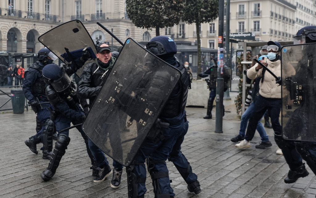 Riot police defend themselves during the chaos in Paris, France on March 22, 2023. 