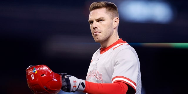 Freddie Freeman of Team Canada removes his helmet after the final out in the second inning of a World Baseball Classic Pool C game against Team Colombia at Chase Field March 14, 2023, in Phoenix, Ariz.