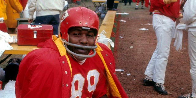 Kansas City Chiefs wide receiver Otis Taylor sits on the bench during a game at Municipal Stadium in Kansas City, Missouri, circa early 1970s.