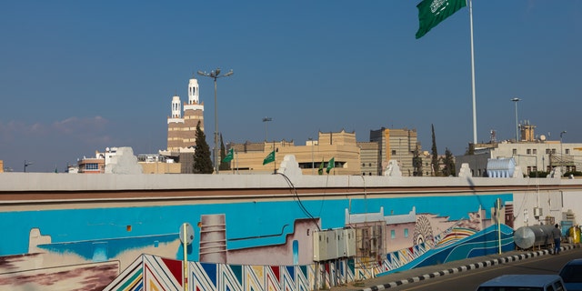 Saudi Arabian flag in front of a fresco, Asir province, Abha, Saudi Arabia. The country announced it executed a man for drug charges over the weekend. 