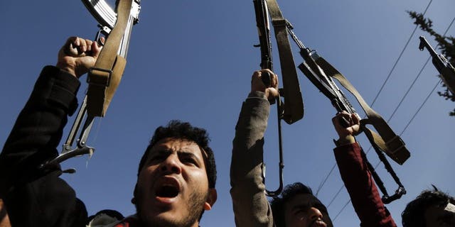 Supporters of Yemen's Huthi movement demonstrate in front of the closed U.S. Embassy in Sanaa on Jan. 18, 2021.