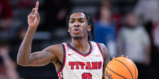 Antoine Davis, #0 of the Detroit Mercy Titans, brings the ball up court during the game against the Cincinnati Bearcats at Fifth Third Arena on Dec. 21, 2022 in Cincinnati.