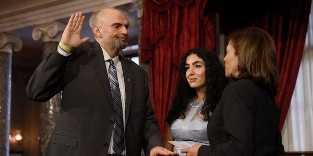 US Vice President Kamala Harris ceremonially swears in US Senator John Fetterman, Democrat of Pennsylvania, for the 118th Congress in the Old Senate Chamber at the US Capitol in Washington, DC, January 3, 2023. 