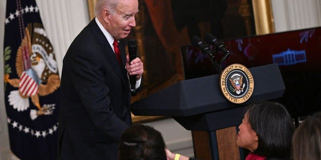 President Biden shakes hands with Ambassador Katherine Tai, U.S. trade representative, as he speaks during a reception to celebrate the Lunar New Year in the East Room of the White House in Washington, D.C., Jan. 26, 2023.