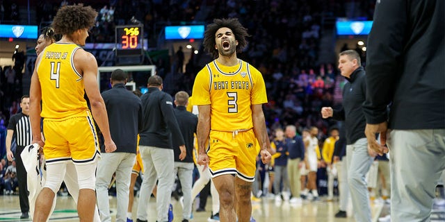 Kent State Golden Flashes guard Sincere Carry (3) celebrates during the first half of the MAC Mens Basketball Tournament Championship game between the Kent State Golden Flashes and Toledo Rockets on March 11, 2023, at Rocket Mortgage FieldHouse in Cleveland, OH.