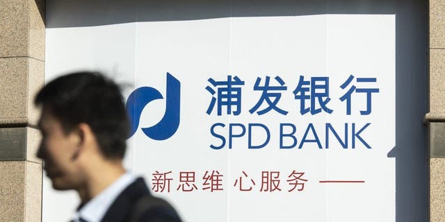 Signage at a Shanghai Pudong Development Bank Co. branch in Shanghai, China, on Tuesday, March 14, 2023. Shanghai Pudong said its joint venture in China with Silicon Valley Bank isn't affected by the turmoil surrounding the US lender, and urged clients to stay calm. 