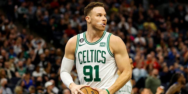 Blake Griffin, #91 of the Boston Celtics, rebounds the ball in the third quarter of the game against the Minnesota Timberwolves at Target Center on March 15, 2023 in Minneapolis. The Celtics defeated the Timberwolves 104-102.