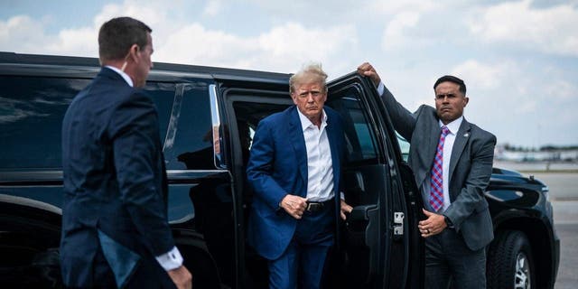 Former President Donald Trump boards his airplane, known as Trump Force One, in route to Iowa at Palm Beach International Airport on Monday, March 13, 2023, in West Palm Beach, FL. 