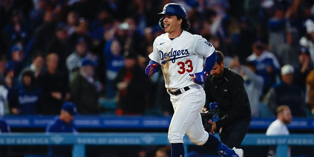 James Outman, #33 of the Los Angeles Dodgers, hits a two-run home run in the sixth inning during the game between the Arizona Diamondbacks and the Los Angeles Dodgers at Dodger Stadium on Thursday, March 30, 2023 in Los Angeles.