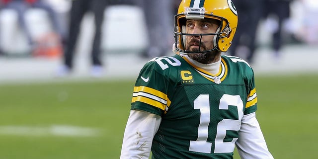 Aaron Rodgers of the Green Bay Packers walks across the field in the second quarter against the Tampa Bay Buccaneers during the NFC championship game at Lambeau Field Jan. 24, 2021, in Green Bay, Wis.