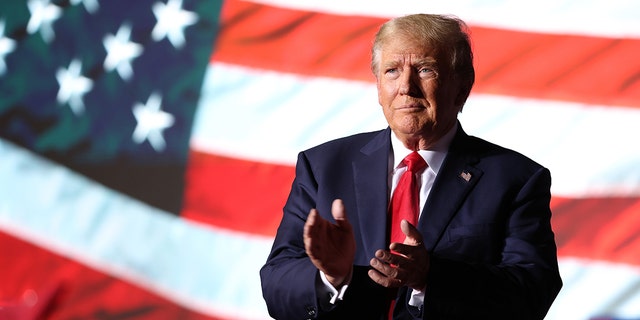 Trump greets supporters during a campaign rally at Minden-Tahoe Airport on October 08, 2022, in Minden, Nevada.