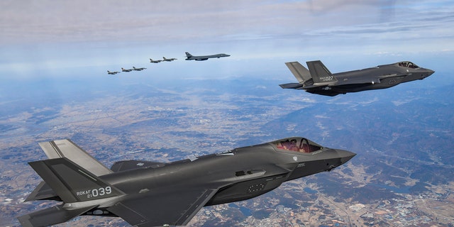 A U.S. B-1B Lancer strategic bomber, four U.S. Air Force F-16 fighter jets and two South Korean Air Force F-35 fighter jets fly over South Korea during the joint air drills in response to North Korea's intercontinental ballistic missile (ICBM) launch on November 19, 2022, at an undisclosed location in South Korea. 