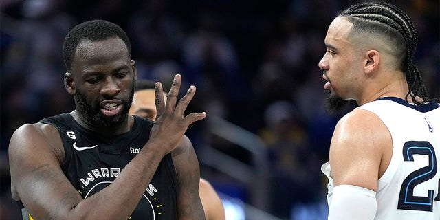 Draymond Green, #23 of the Golden State Warriors, and Dillon Brooks, #24 of the Memphis Grizzlies, exchange word with each other during the second quarter at Chase Center on December 25, 2022, in San Francisco, California.  