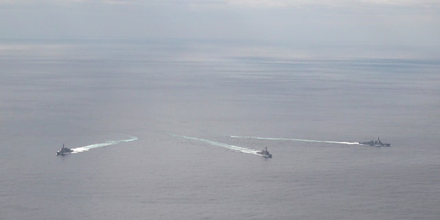 In this handout image released by the South Korean Defense Ministry, South's Sejong the Great, the U.S.'s USS Barry and the Japan Maritime Self-Defense Force's JS Atago are seen during a combined naval exercise on February 22, 2023.