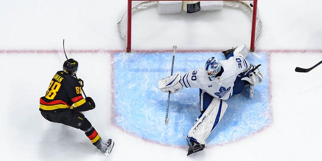 Nils Aman (88) of the Vancouver Canucks scores a goal on Matt Murray (30) of the Toronto Maple Leafs during the third period of an NHL game at Rogers Arena March 4, 2023, in Vancouver, British Columbia, Canada. 