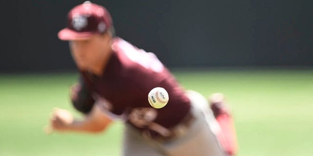 The NCAA logo is seen on the ball Texas A&amp;M pitches against the Tennessee Volunteers in the sixth inning at Lindsey Nelson Stadium on March 25, 2023 in Knoxville, Tennessee.