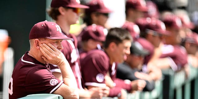 Texas A&amp;M Aggies head coach Jim Schlossnagle watches their game against the Tennessee Volunteers from in the dugout in the ninth inning at Lindsey Nelson Stadium on March 25, 2023 in Knoxville, Tennessee.