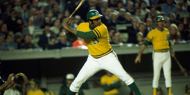 Outfielder Jesús Alou, #22 of the Oakland Athletics, readies his swing against the New York Mets during the World Series at Shea Stadium on October 1973 in Flushing, New York. 